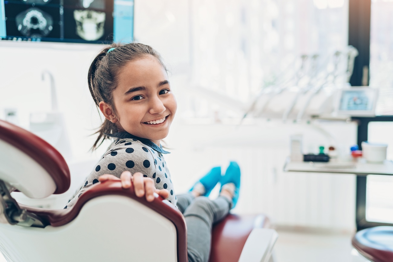 little girl visiting a pediatric dentist office