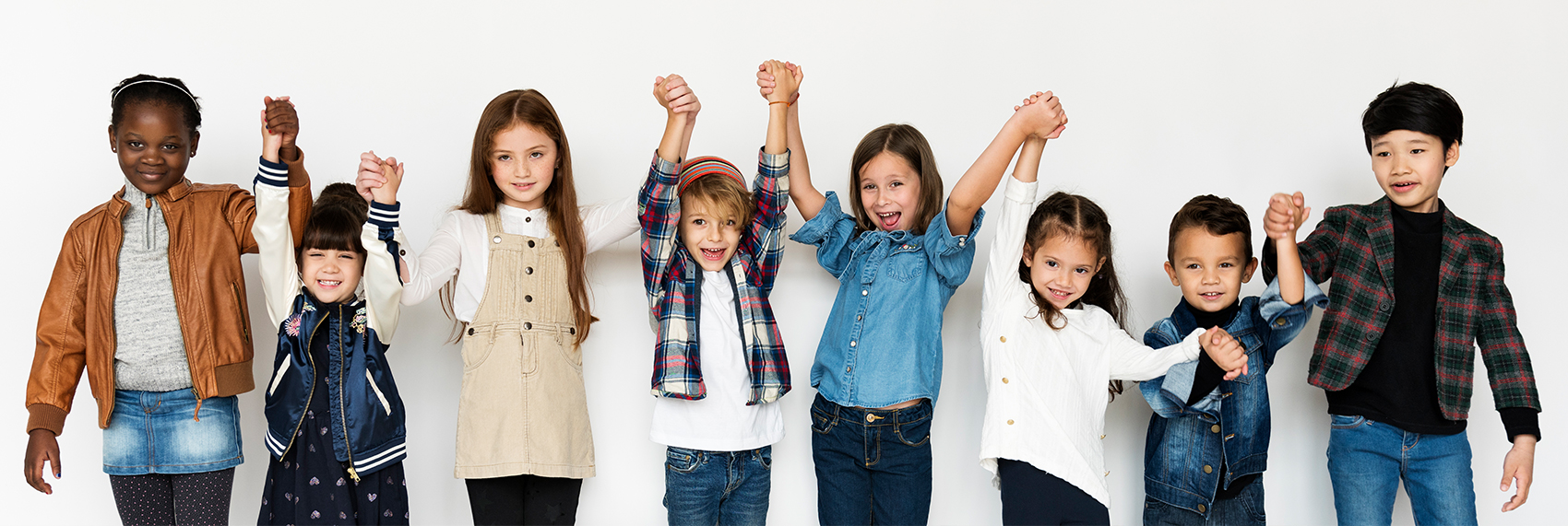 group of kids holding up hands together