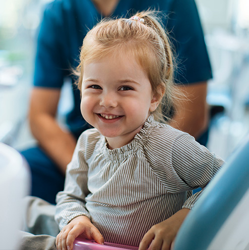 cute young girl smiling at camera